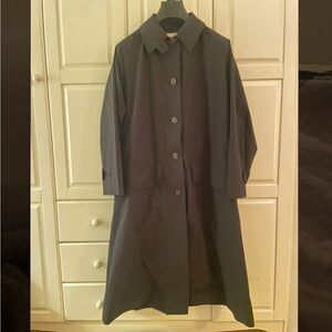 Studio Nicholson timeless chic black trench